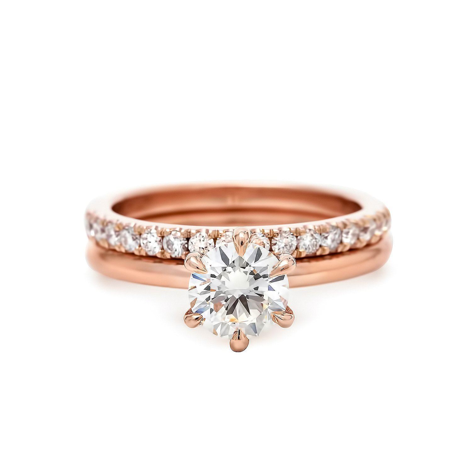 Rose gold claw prong engagement ring and eternity band