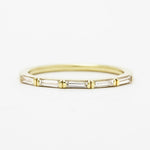 A modern diamond wedding band made with long baguette diamonds.