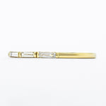 A side profile view of the diamond baguette wedding band