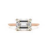 Emerald cut diamond solitaire east west engagement ring