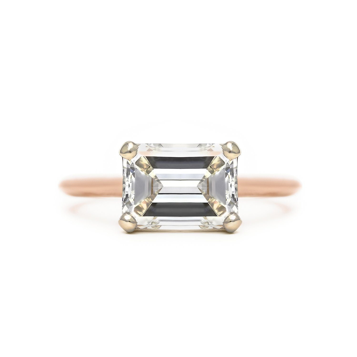Emerald cut diamond solitaire east west engagement ring