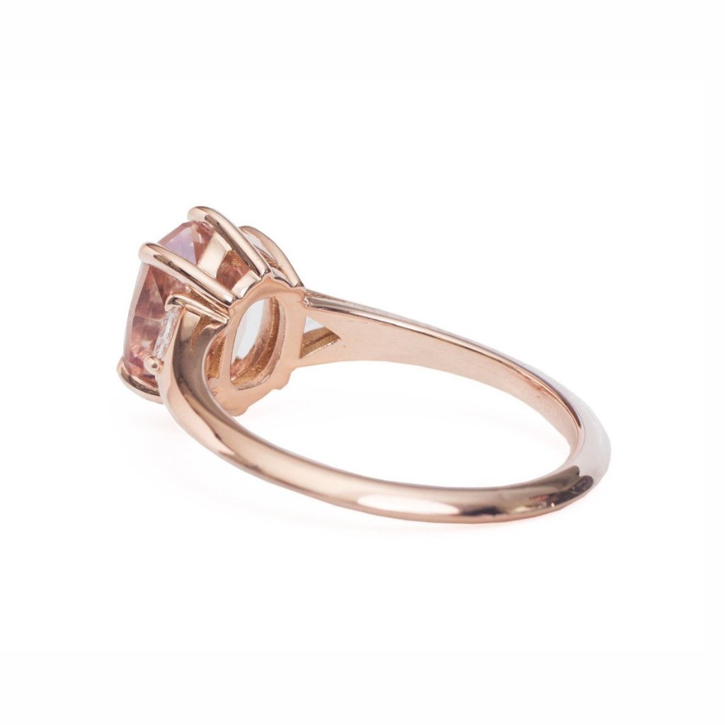Claw prong oval diamond engagement ring Mahenge garnet